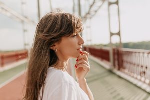 hopeful young woman looking into the distance